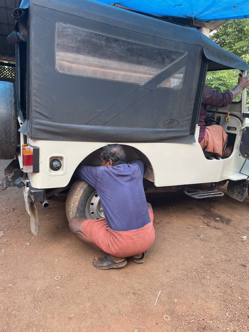 Ashokettan working on the Jeep